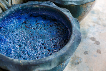 indigo color in clay pot for tie batik dyeing.