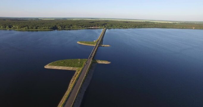 Aerial view to bridge on river at sunset, Severskiy Donets river
