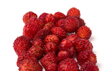 Macro view wild strawberry on white background. Forest red berries