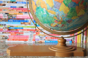 A close up of the globe on the bookshelf in the library selective focus and shallow depth of field
