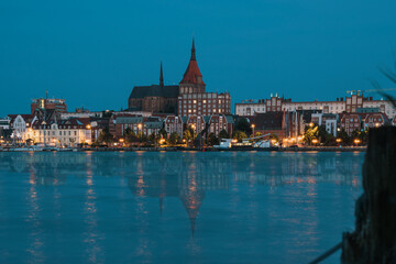 Fototapeta premium Rostock. Night Panorama view to Rostock in Germany. River Warnow and City port.