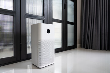 Indoor air purifier with digital monitor screen in bedroom, that show air quality in the room and air pollution levels in the room. with glass sliding door.