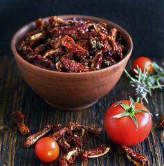 sun dried tomatoes with herbs. reserves summer vegetables for the winter. copy space