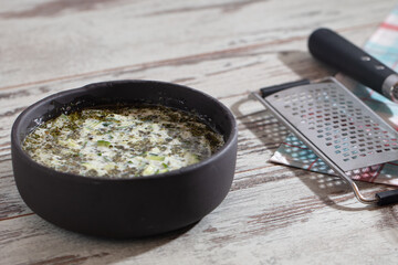 Yoghurt sauce tzatziki with herbs, cucumber and garlic, top view