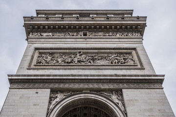 Architectural fragment of Arc de Triomphe. Arc de Triomphe de l'Etoile on Charles de Gaulle Place is one of the most famous monuments in Paris. France.