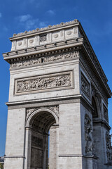 Fototapeta na wymiar Architectural fragment of Arc de Triomphe. Arc de Triomphe de l'Etoile on Charles de Gaulle Place is one of the most famous monuments in Paris. France.