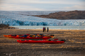 Kayak expedition between icebergs in Narsaq fiords, South West Greenland, Denmark © Alberto Gonzalez 