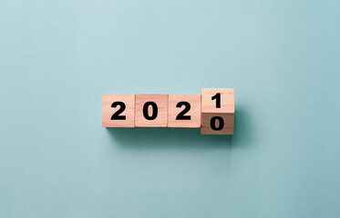 Flipping of wooden cubes block to change 2020 to 2021 year. Merry Christmas and happy new year...