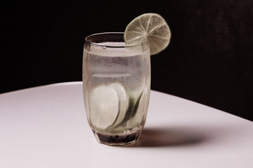 Lemon juice in a clear glass with decorative lime