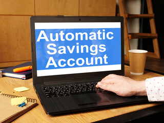 Automatic savings account is shown on the conceptual business photo