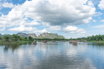 Rafting has many arches of houses in the river, mountains in the background