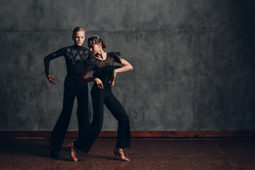 Young couple dancing in ballroom dance Paso doble.