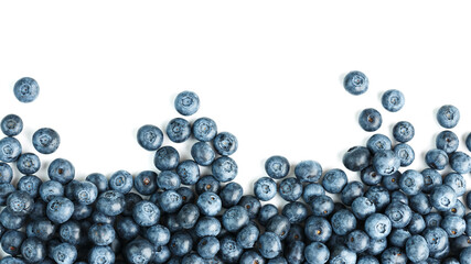 Tasty blueberries fruit are scattered on a white background. Frame
