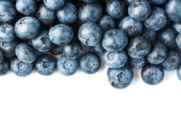 Tasty blueberries fruit are scattered on a white background. Frame