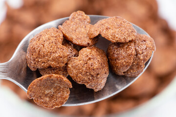 Close up: cereal chocolate on a spoon