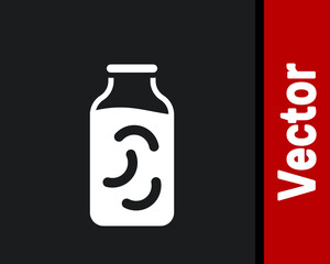 White Pickled cucumbers in a jar icon isolated on black background. Vector.