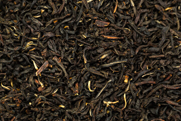 Leaves of black premium dry tea on a white background