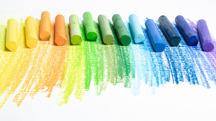 Multi-colored pastel crayons. Materials for drawing and creativity. Bright water-based paints. School supplies. Hobbies and creativity