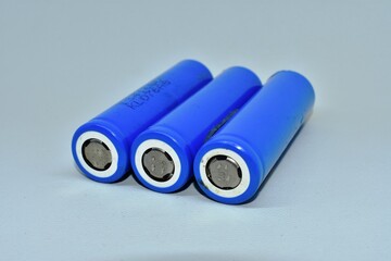 Three rechargeable 18650 lithium-ion batteries. isolated on a white background. batteries for...