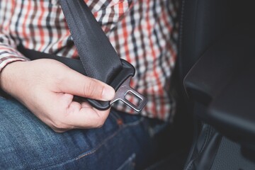 Young man and safety belt car.concept safety first .