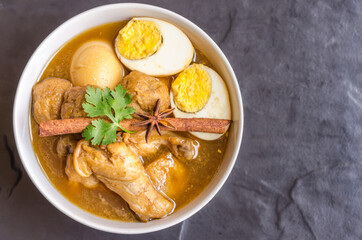Eggs and chicken in brown sauce chicken stewed in the sweet brown Gravy,Hard boiled egg and stewed chicken in gravy sauce,Thai Cuisine call Kai Pha Lo
