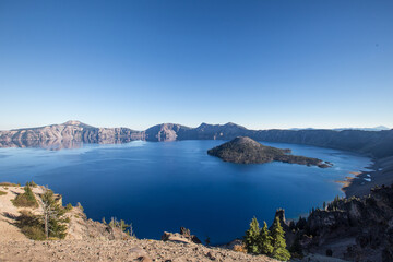 Fototapeta na wymiar Panorama view of Crater Lake in Oregon, with blue sky.