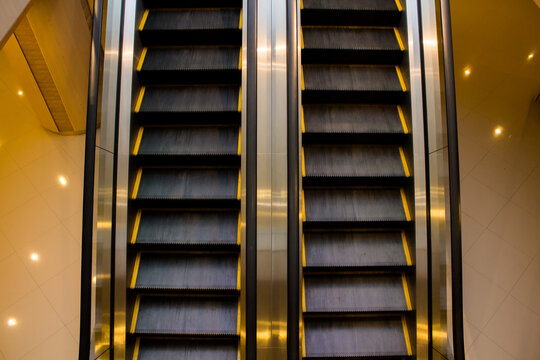 Escalators in hotel building in warm tone