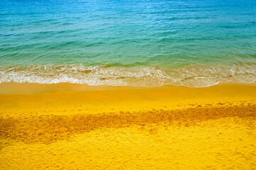 Wave of blue ocean on  beach.