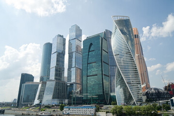 Fototapeta na wymiar modern skyscrapers business center with blue sky and clouds, reflections on glass, Moscow city