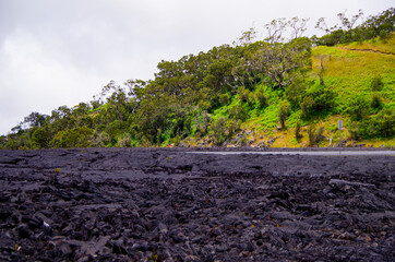 Country road through lava field in Mauna Kea State Park in Halepohaku area on Big Island in Hawaii...