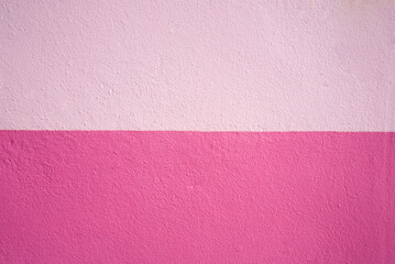 Abstract pink color of wall texture background with copy space for design and decoration. Two-tone background fashionable glamorous divided into two parts.