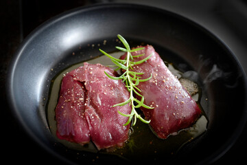 cooking at home - roasted game meat from a chamois buck