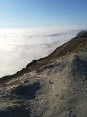 above the clouds from the top of the mountain