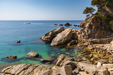 View of the coastal path along the cliffs of Plaja D'Aro a Calonge, Costa Brava, Catalonia, Spain.