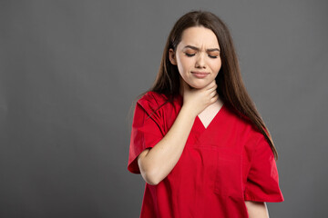 Fototapeta premium Portrait of a nurse having throat pain from virus