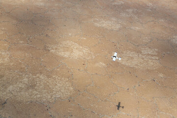 Aerial view of an airplane flying over Lake Magadi in the Great Rift Valley, Kenya. Lake Magadi is the southernmost lake in the Kenyan Rift Valley, north of Tanzania's Lake Natron.