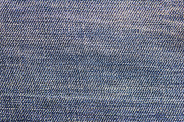 Denim jeans texture background. Dark stylish blue and white color jeans fabric design, empty unisex jean cloth surface close up detailed view