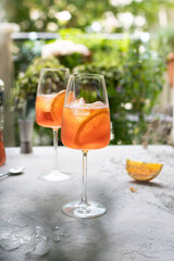 Summer refreshing aperol spritz cocktail in wine glass