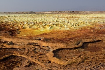 Fototapeta premium Salt ponds, bubbling chimneys and salt terraces form the bottom of the volcanic crater Dallol, Ethiopia: The Hottest Place on Earth,Danakil Depression,North Ethiopia,Africa