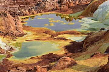 Fototapeta na wymiar Salt ponds, bubbling chimneys and salt terraces form the bottom of the volcanic crater Dallol, Ethiopia: The Hottest Place on Earth,Danakil Depression,North Ethiopia,Africa