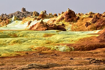 Salt ponds, bubbling chimneys and salt terraces form the bottom of the volcanic crater Dallol,...