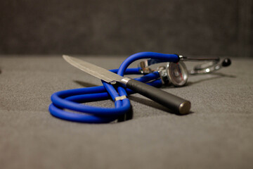 stethoscope and knife 