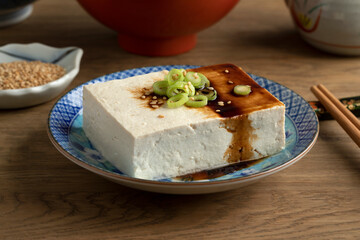 Piece of regular tofu in a Japanese bowl