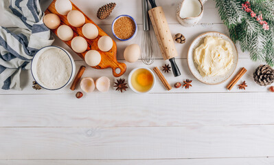 Ingredients for baking and Breakfast with eggs, flour, sugar, milk and butter on a white wooden background. Delicious and healthy food. Flat lay. Top view with copy space