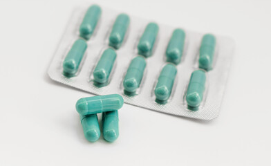 Pile of scattered capsules on a white background. capsules isolated white capsule pharmacy bottle pill drug concept