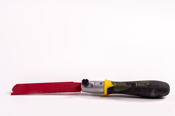 Mini-hacksaw isolated on a white background