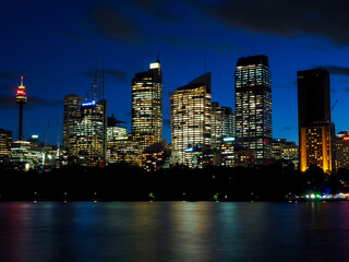 Obraz na płótnie Canvas Illuminated Buildings In City At Night