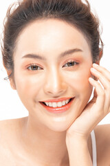 Fototapeta premium Beautiful Asian woman looking at camera smile with clean fresh skin