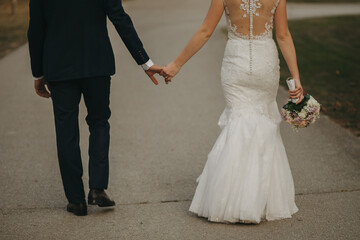 Fototapeta na wymiar bride and groom walking in autumn