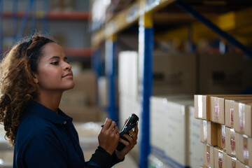 Fototapeta premium During working hours in the warehouse, there is a checking, checking, stock for quality products, safe for customers. women worker warehouse
